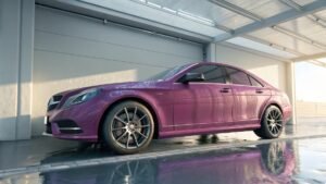 alt text: Car parked inside a clean garage, shielded from elements